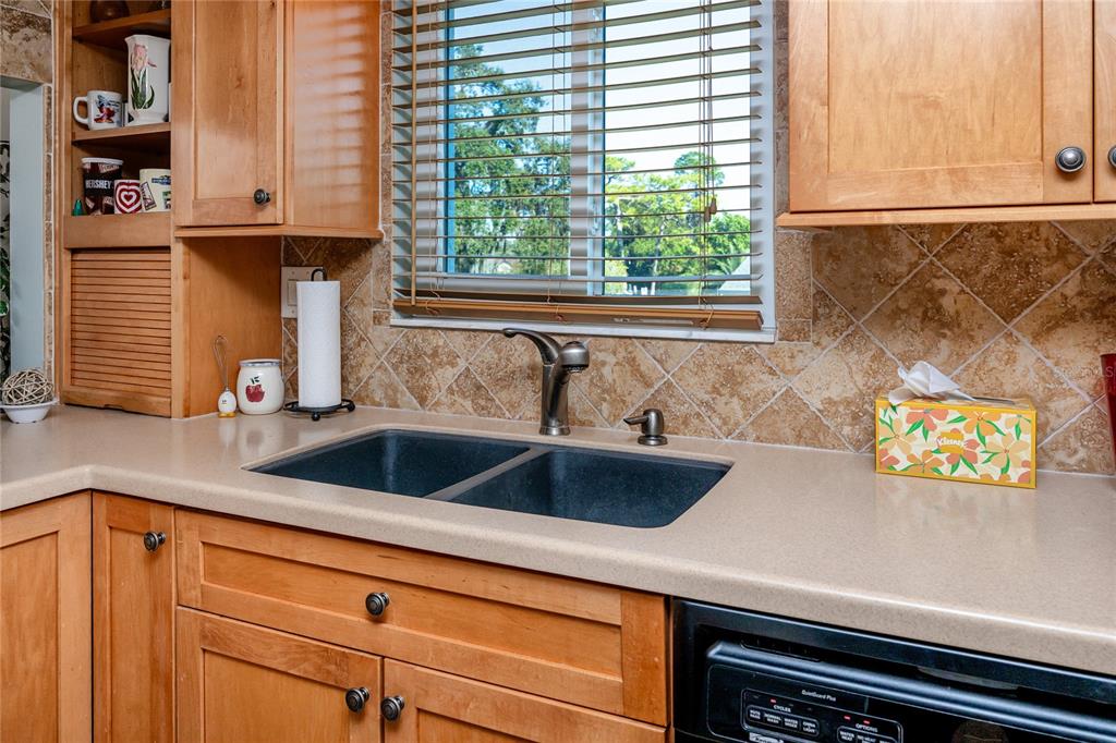 2737 Enterprise Road East, Unit 112 Clearwater, FL 33759 - Photo 17 of 43 a kitchen with a sink and a window