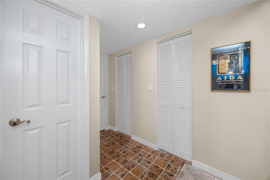 2737 Enterprise Road East, Unit 112 Clearwater, FL 33759 - Photo 26 of 43 a view of a hallway with wooden floor and closet