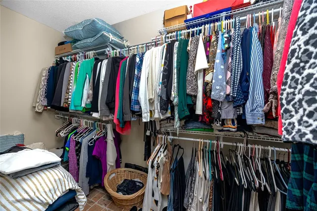 a bedroom with bed and a chandelier