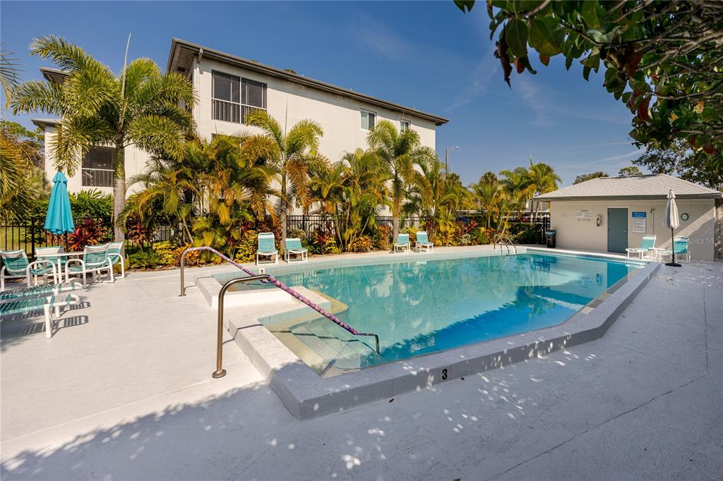 2737 Enterprise Road East, Unit 112 Clearwater, FL 33759 - Photo 33 of 43 a view of a swimming pool with a patio