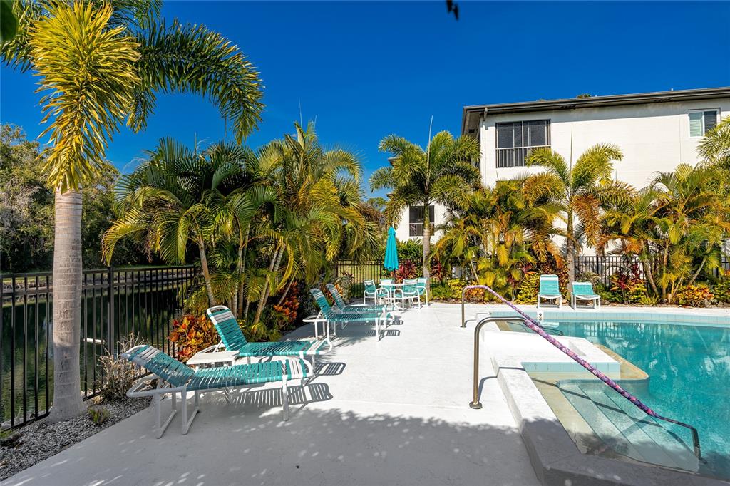2737 Enterprise Road East, Unit 112 Clearwater, FL 33759 - Photo 34 of 43 a view of a swimming pool with a patio