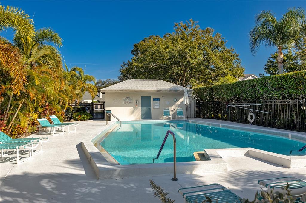 2737 Enterprise Road East, Unit 112 Clearwater, FL 33759 - Photo 37 of 43 a front view of a house with garden