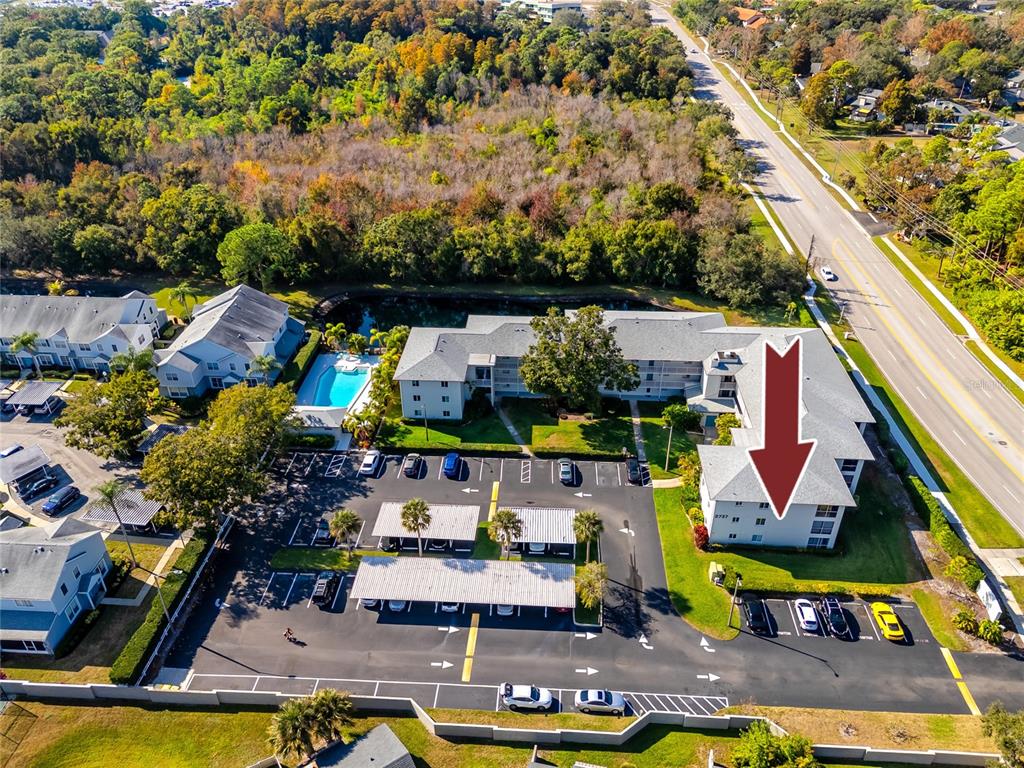 2737 Enterprise Road East, Unit 112 Clearwater, FL 33759 - Photo 39 of 43 an aerial view of residential houses with outdoor space