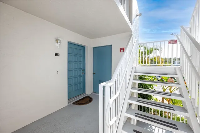 a view of a hallway with windows