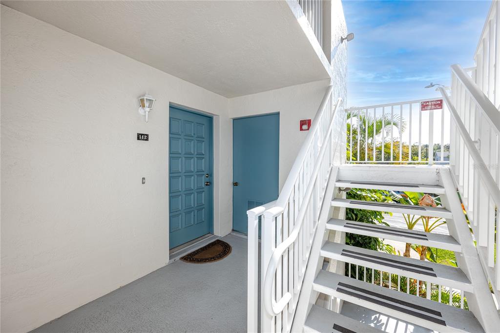 2737 Enterprise Road East, Unit 112 Clearwater, FL 33759 - Photo 6 of 43 a view of a hallway with windows