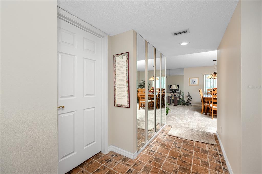 2737 Enterprise Road East, Unit 112 Clearwater, FL 33759 - Photo 8 of 43 a view of a hallway with a livingroom and a livingroom