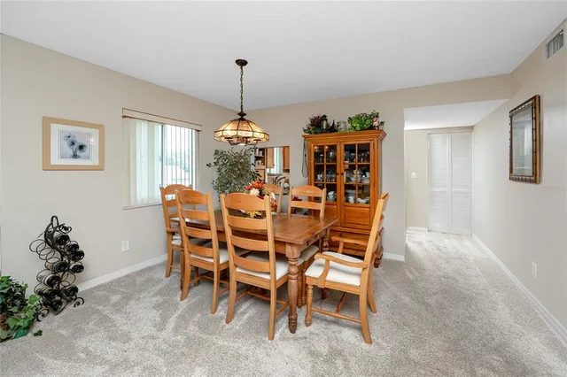 a dining room with furniture and window