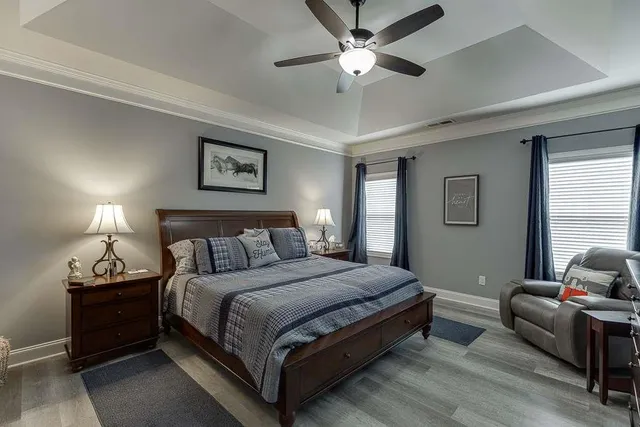 a bedroom with a bed and a lamp