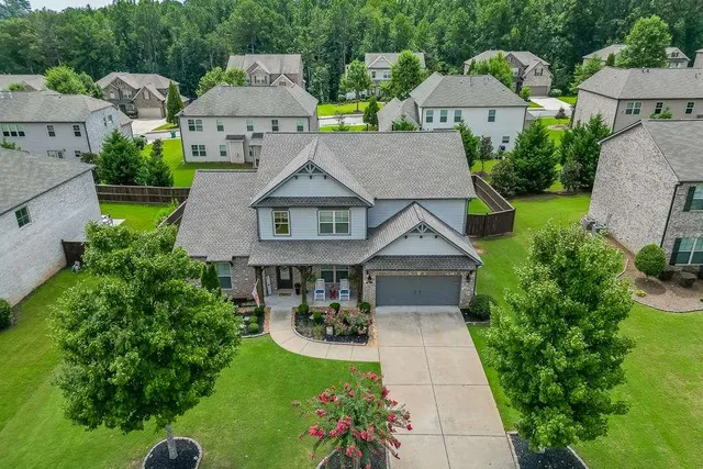 an aerial view of a house with outdoor space