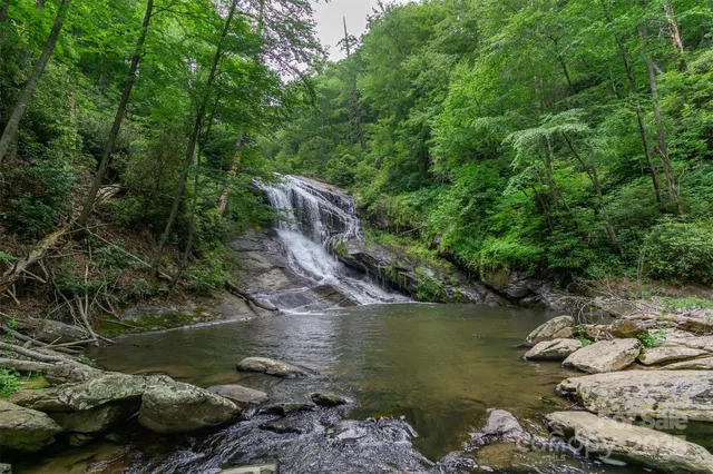 an aerial view of a houses with lake view