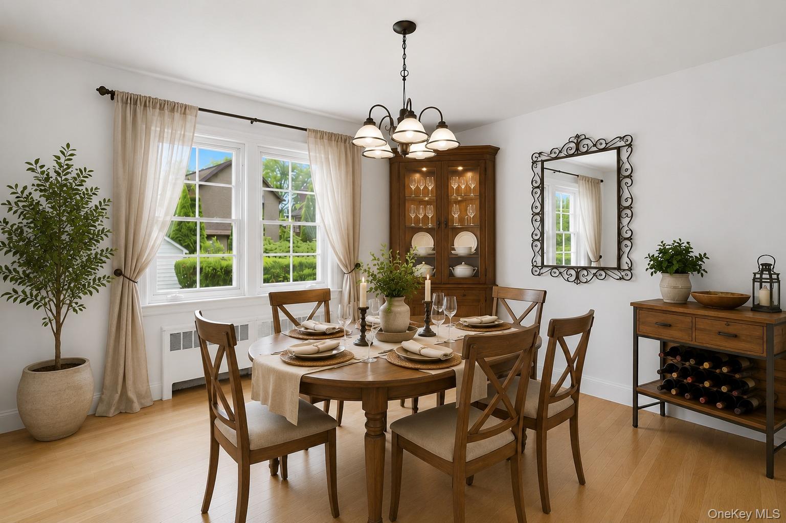 144 Bell Road Scarsdale, NY 10583 - Photo 11 of 49 Bright dining area featuring wood-finish flooring, a multi-pane window