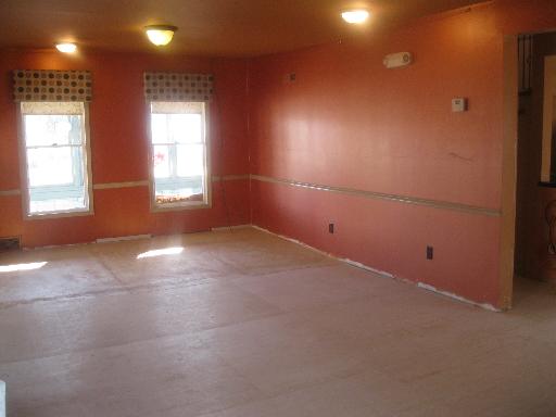 519 West State Street Sycamore, IL 60178 - Photo 3 of 16 an empty room with a empty space and windows