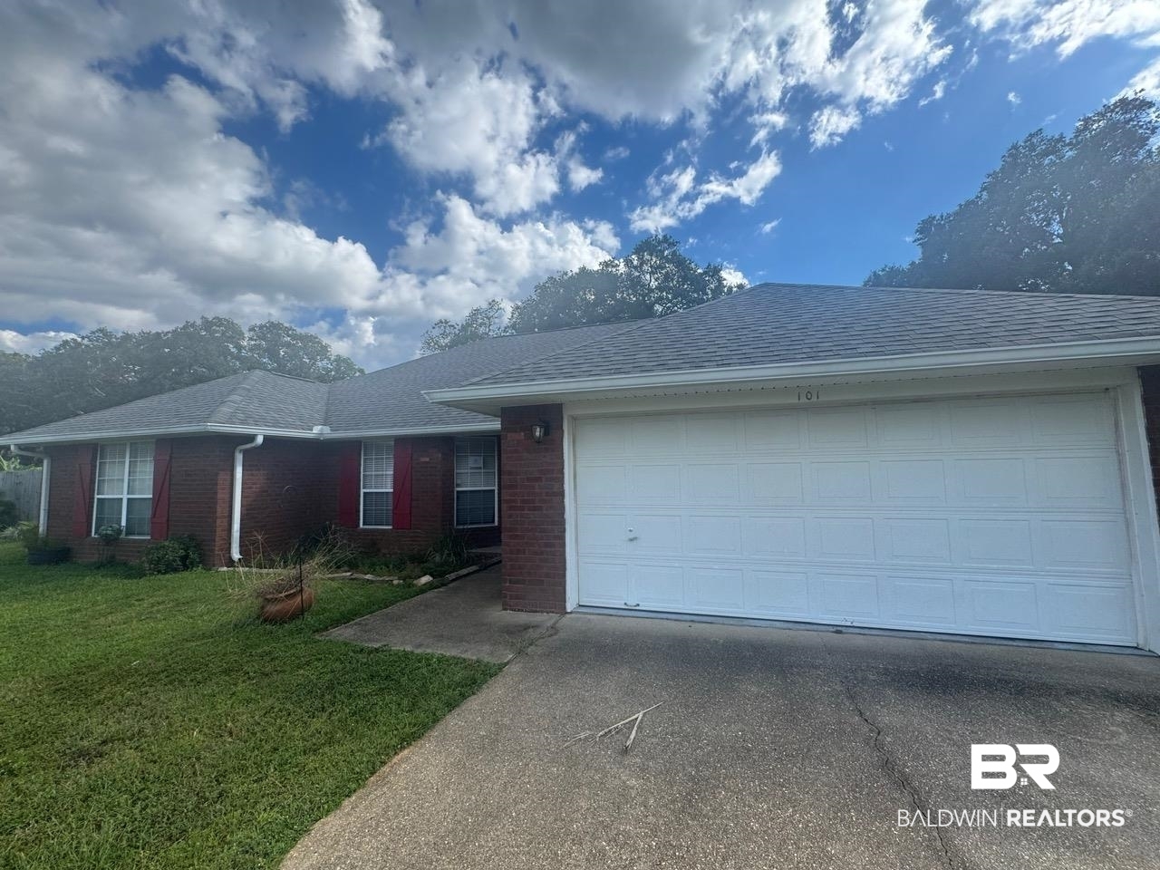 101 Monteith Circle Foley, AL 36535 - Photo 26 of 28 Single story home featuring roof with shingles, a front yard, brick siding, and driveway