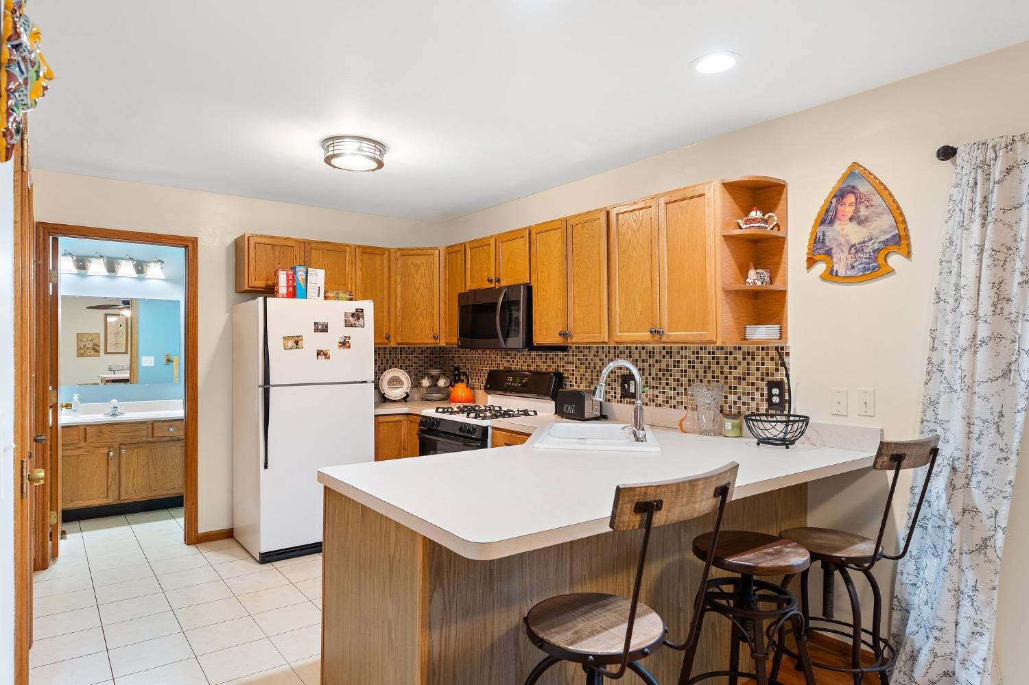 117 Indian Ridge Michigan City, IN 46360 - Photo 3 of 10 a view of a dining room with furniture and chandelier