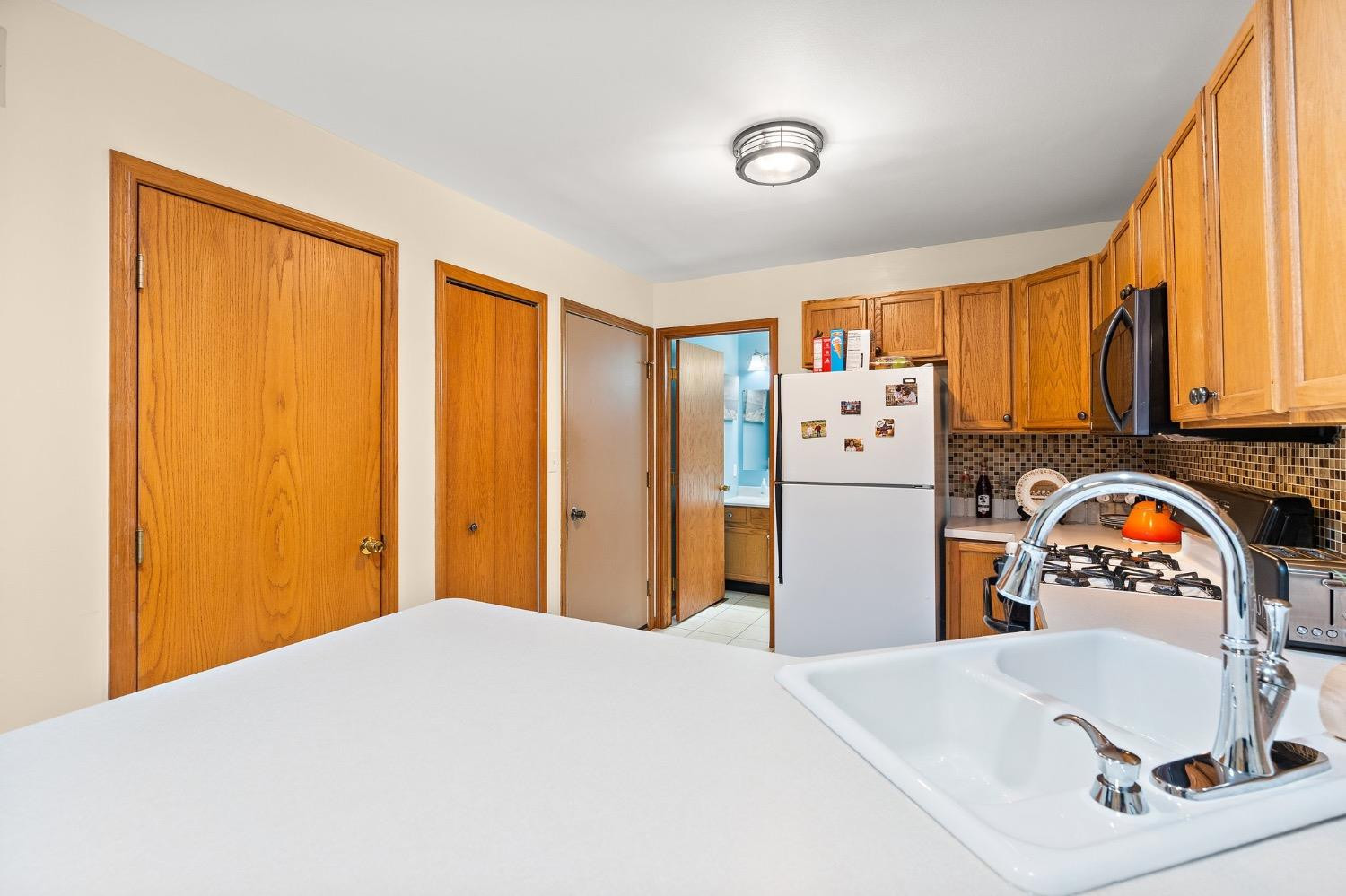 117 Indian Ridge Michigan City, IN 46360 - Photo 5 of 10 a bedroom with a bed and a refrigerator