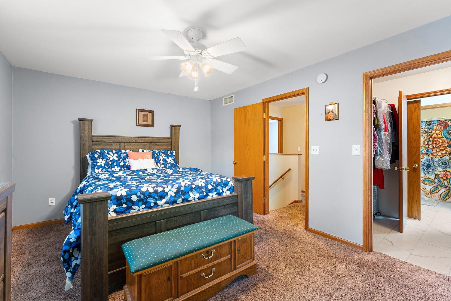 117 Indian Ridge Michigan City, IN 46360 - Photo 7 of 10 a bed room with a bed mirror and a chandelier