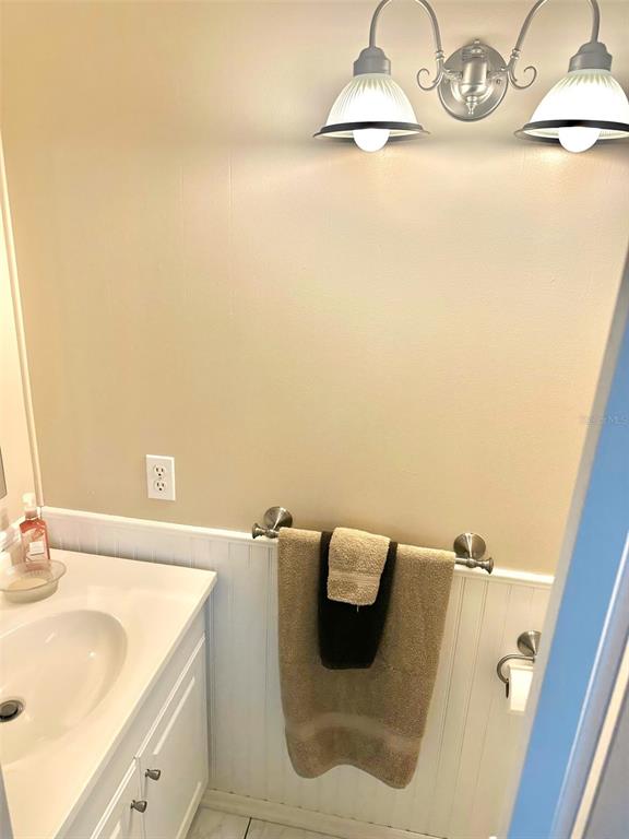 2000 East Bay Drive, Unit 102 Largo, FL 33771 - Photo 12 of 17 a bathroom with a sink and a vanity