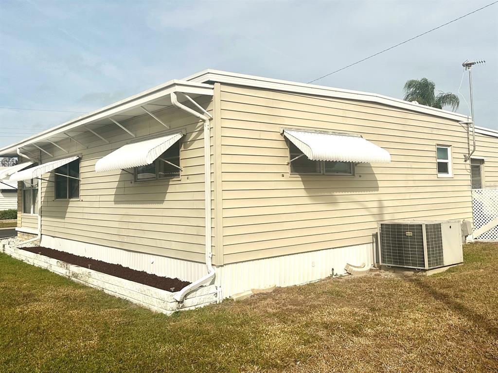 2000 East Bay Drive, Unit 102 Largo, FL 33771 - Photo 17 of 17 a view of a house with a yard