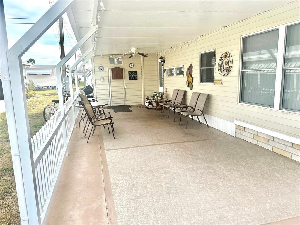 2000 East Bay Drive, Unit 102 Largo, FL 33771 - Photo 2 of 17 a lobby with furniture and floor to ceiling windows
