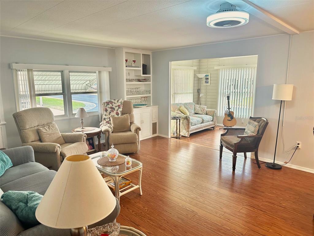 2000 East Bay Drive, Unit 102 Largo, FL 33771 - Photo 3 of 17 a living room with furniture and a large window