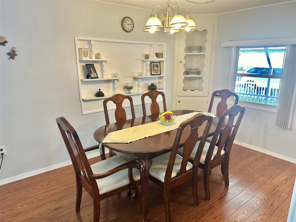 2000 East Bay Drive, Unit 102 Largo, FL 33771 - Photo 7 of 17 a view of a dining room with furniture window and wooden floor