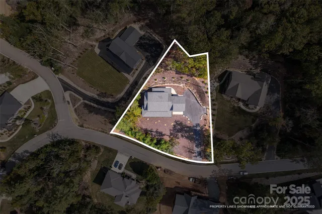 an aerial view of house with yard