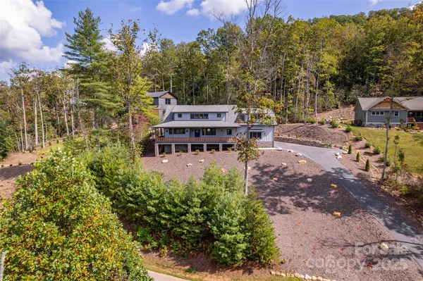 a roof deck with a table and a chairs