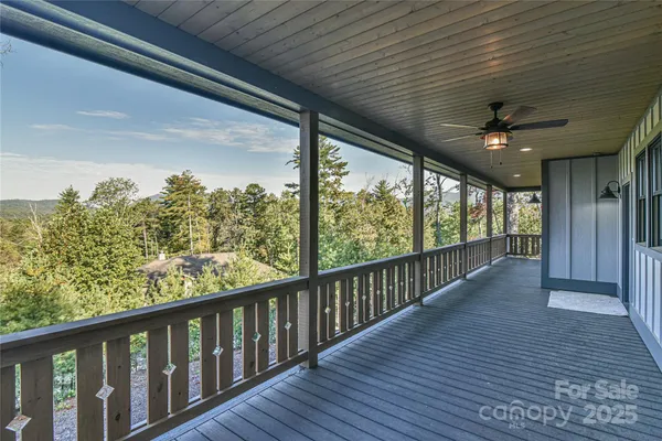 a view of a balcony with wooden floor
