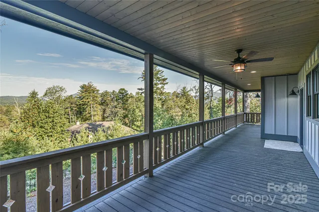 a view of a balcony with wooden floor