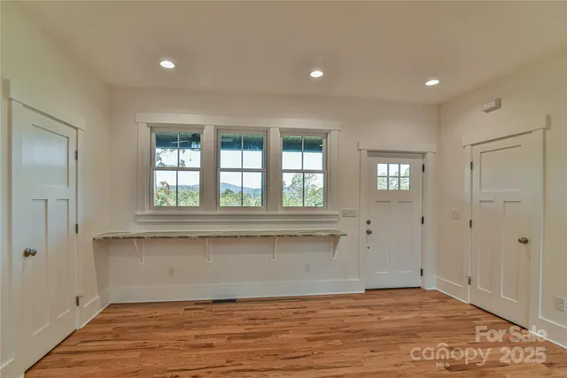 a view of entryway with wooden floor