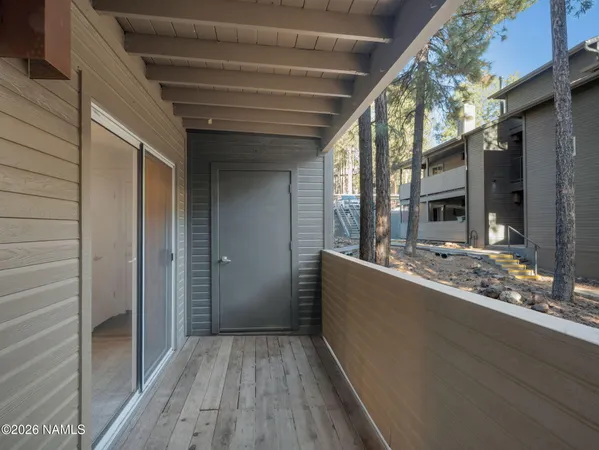 a view of backyard with tub and wooden floor