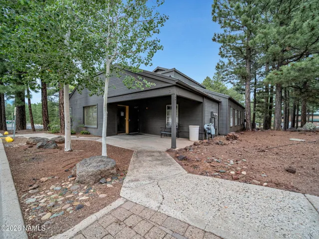 a porch with a table and chairs in patio