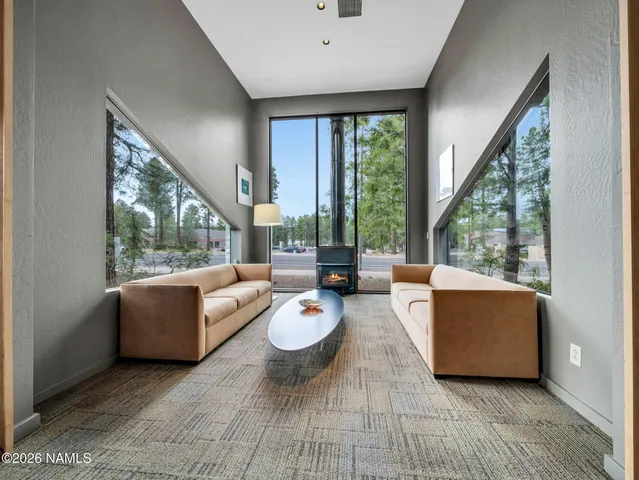 a view of a livingroom with furniture and window