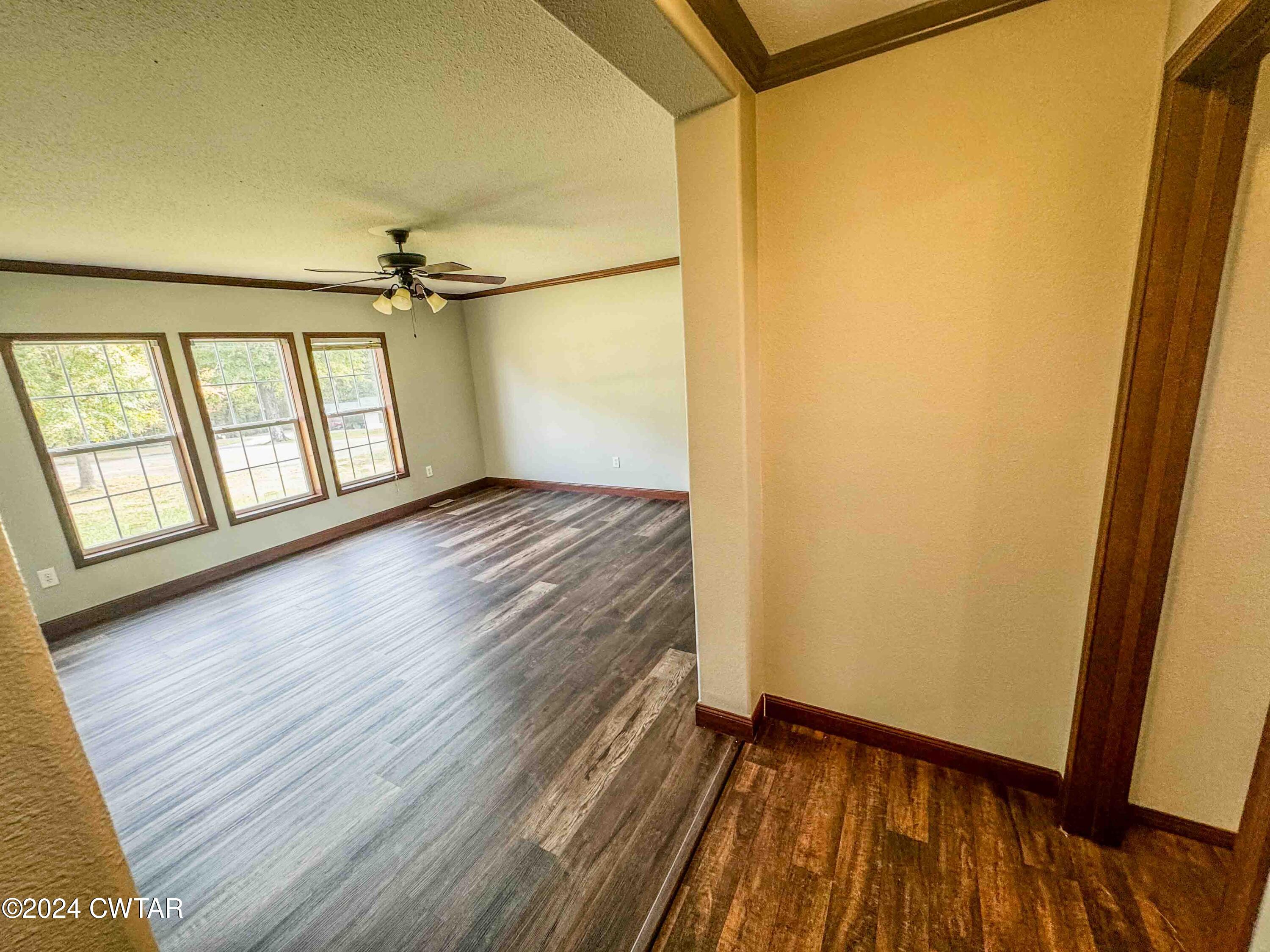 3345 Buchanan Road Buchanan, TN 38222 - Photo 33 of 40 a view of an empty room with a window and wooden floor