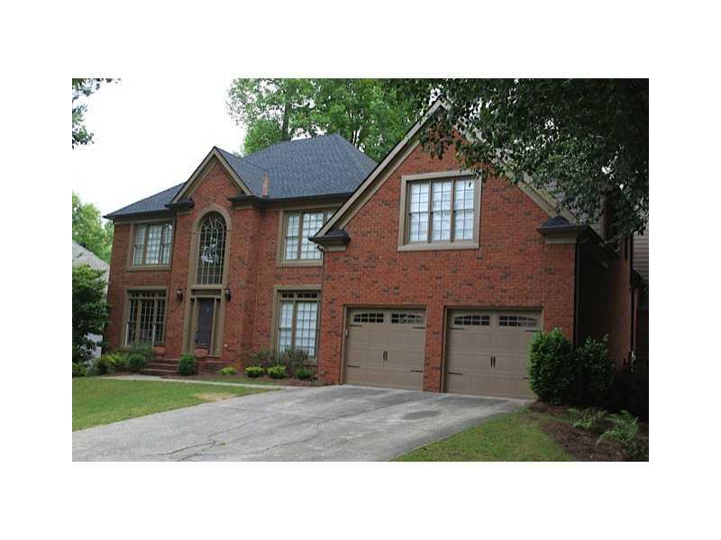 Exterior Front. 3 Side Brick home, freshly painted with new roof and gutters, and new garage doors!