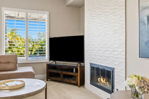 a kitchen with granite countertop a stove sink and cabinets