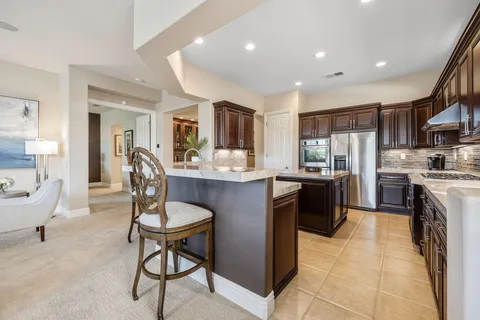 a bedroom with a large bed and a flat screen tv