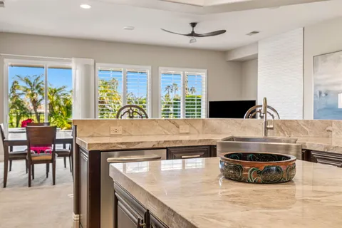 a spacious bathroom with a double vanity sink a mirror and a shower
