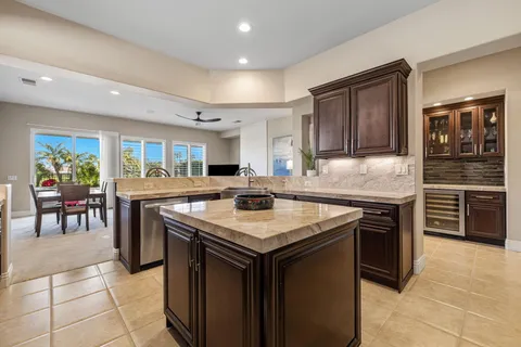 a bathroom with double vanity sinks and a large mirror