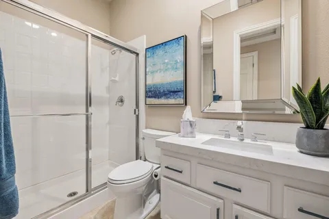 a view of a patio with table and chairs under an umbrella