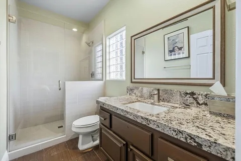 a kitchen with a stove and a refrigerator
