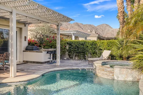 a kitchen with stainless steel appliances granite countertop a stove and a refrigerator