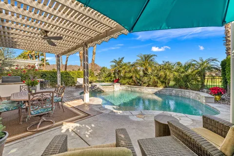 a kitchen with a sink cabinets and window