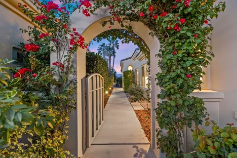 a front view of a house with flower pots