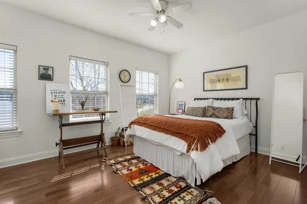a bed room with a bed and a window