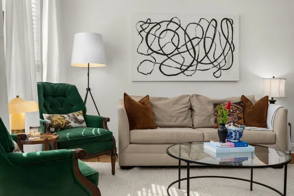 a living room with furniture and a lamp