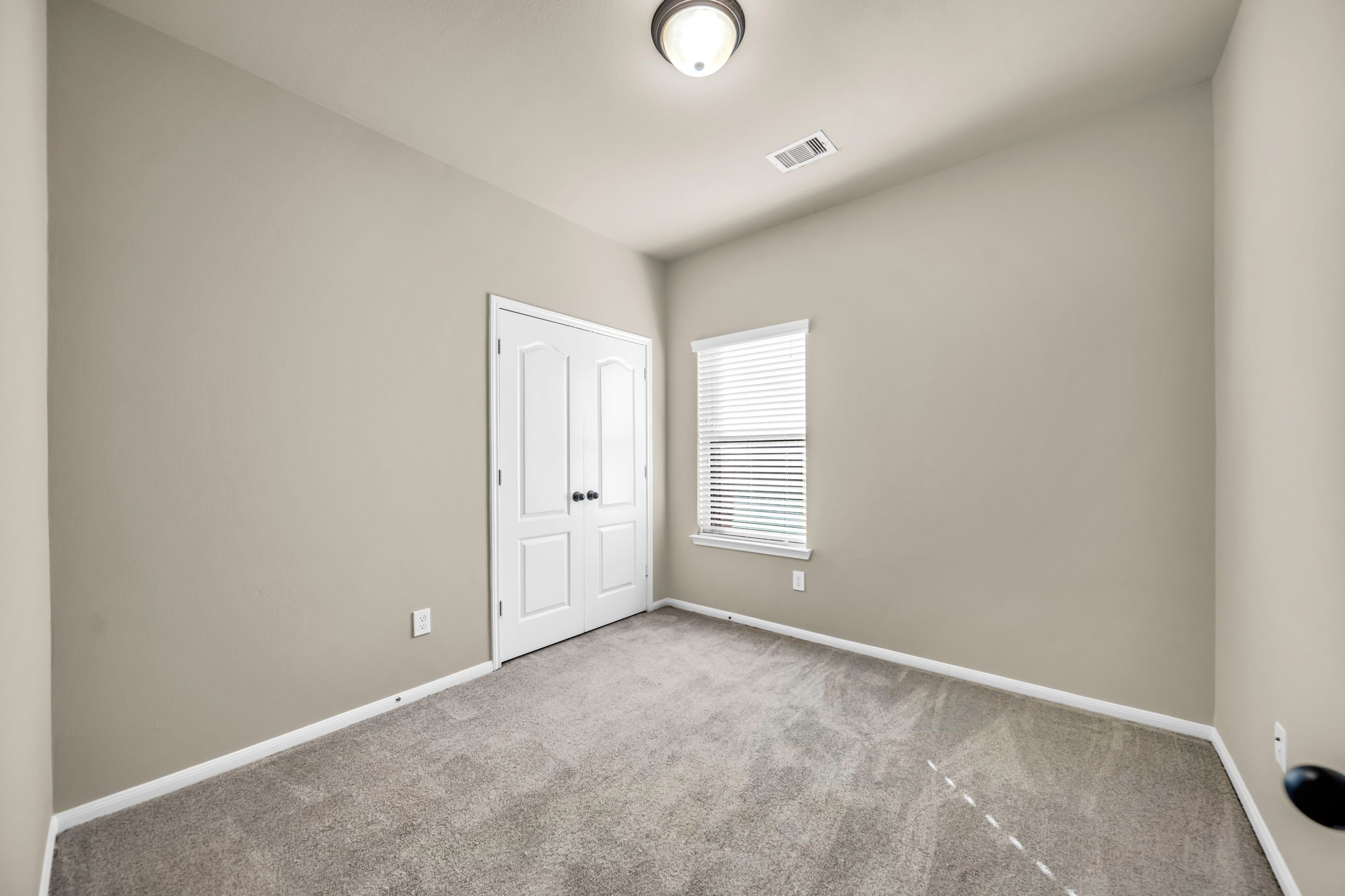 2614 Winding Creek Way Conroe, TX 77385 - Photo 16 of 23 a view of an empty room with a window