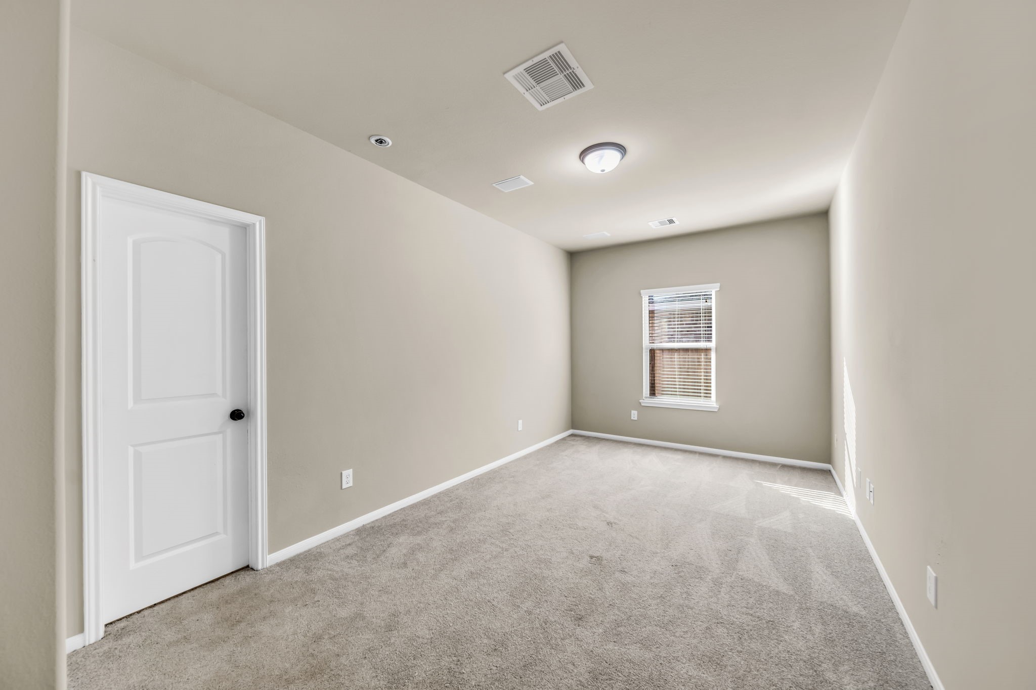 2614 Winding Creek Way Conroe, TX 77385 - Photo 17 of 23 a view of an empty room with a window
