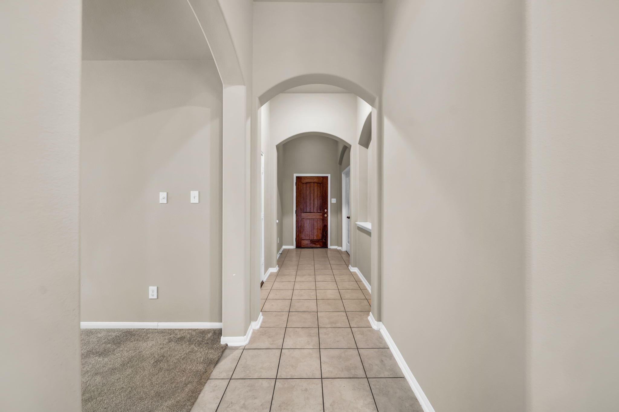 2614 Winding Creek Way Conroe, TX 77385 - Photo 2 of 23 a view of a hallway with wooden floor and a bathroom