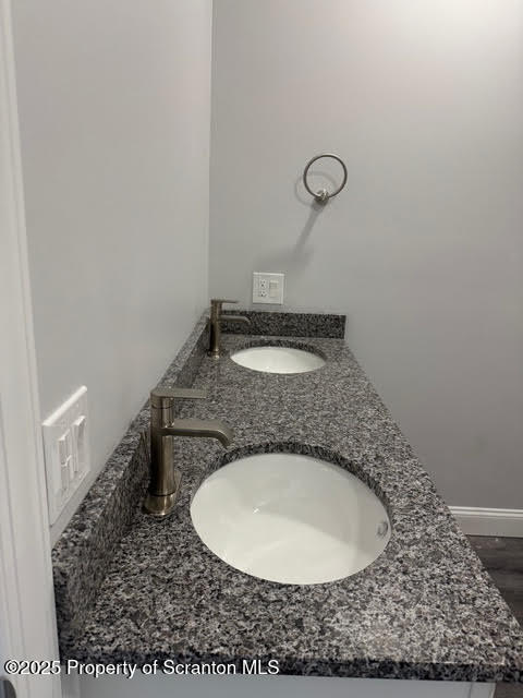 408 Circle Drive Taylor, PA 18517 - Photo 13 of 33 a bathroom with a granite countertop sink and mirror